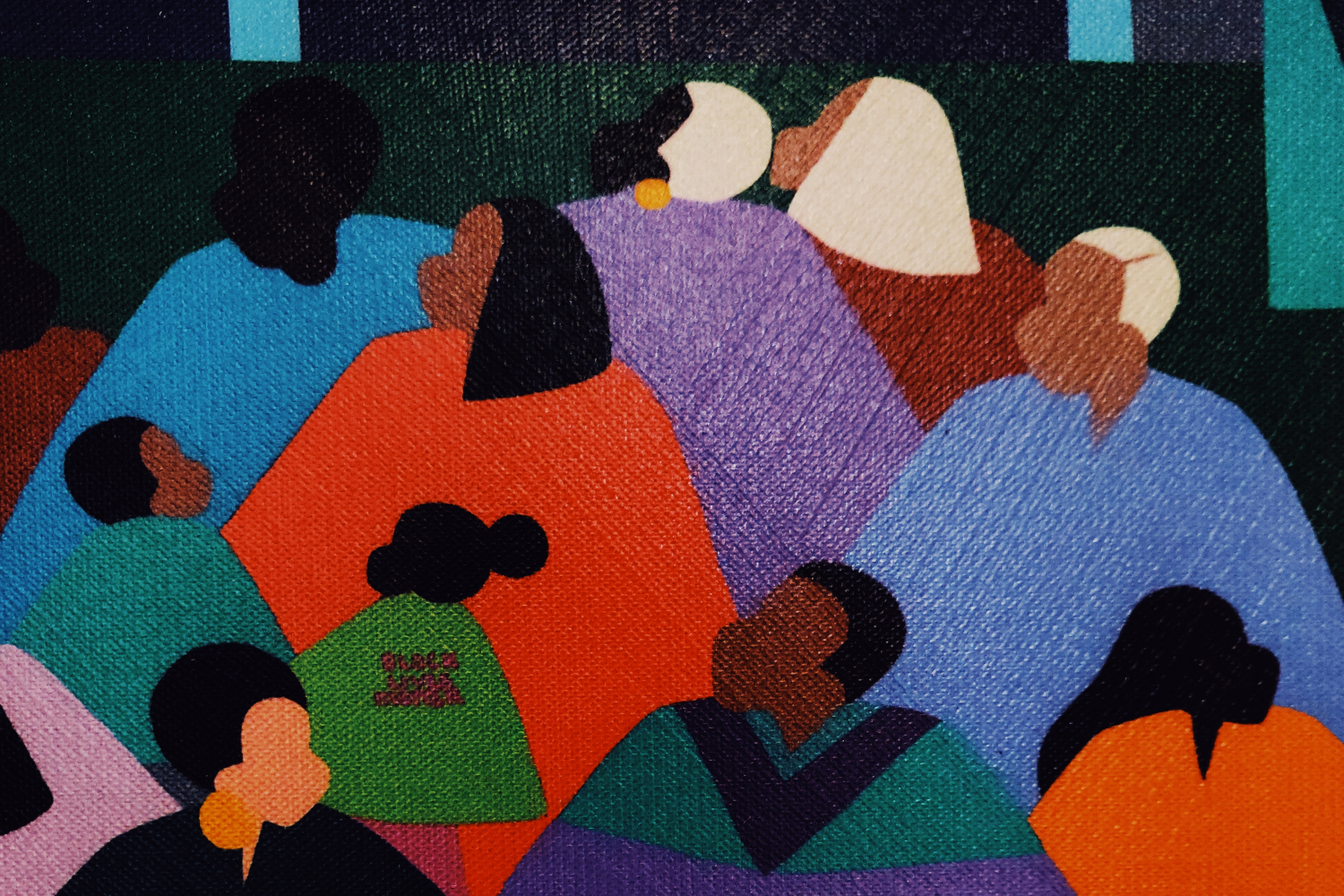 Colourful of many people of looking up. "Black lives matter" is painted very small on a shirt.