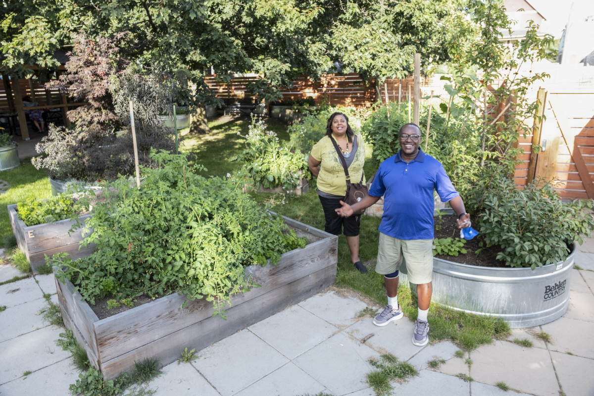 Siobhan Barker and Lama Mugabo at the community garden at Nora Hendrix Place.