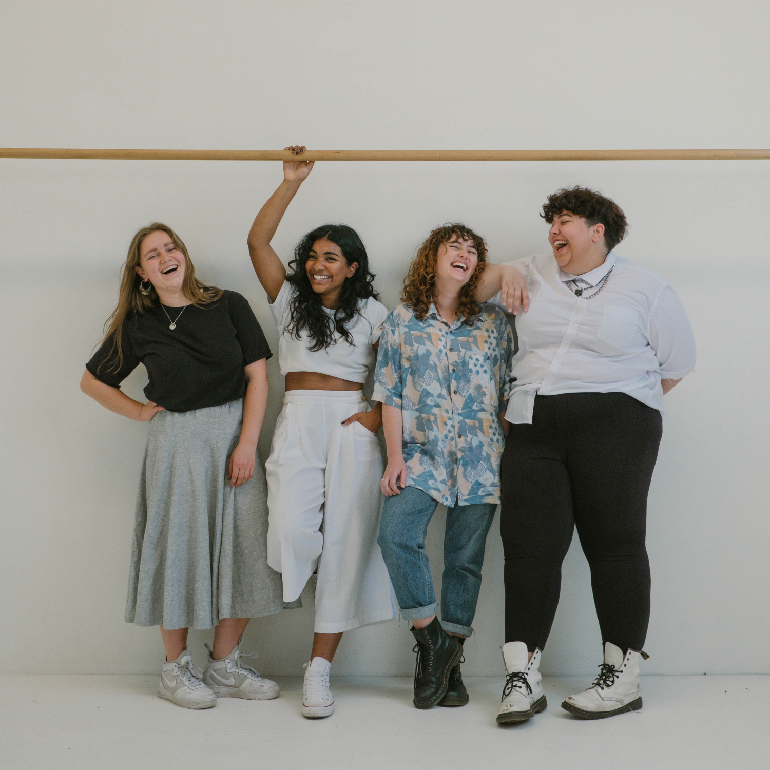 Four friends laughing