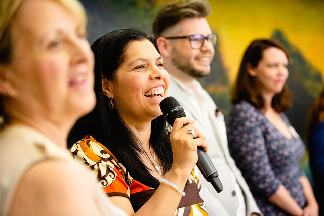 NSG network hub coordinator Blanca talking into a mic.