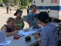 Families sign up for the Anarchist Mountain Fire Safety training day.
