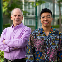 Kevin McCort and Crecien Bencio stand against a backdrop of Renfrew-Collingwood neighbourhood 