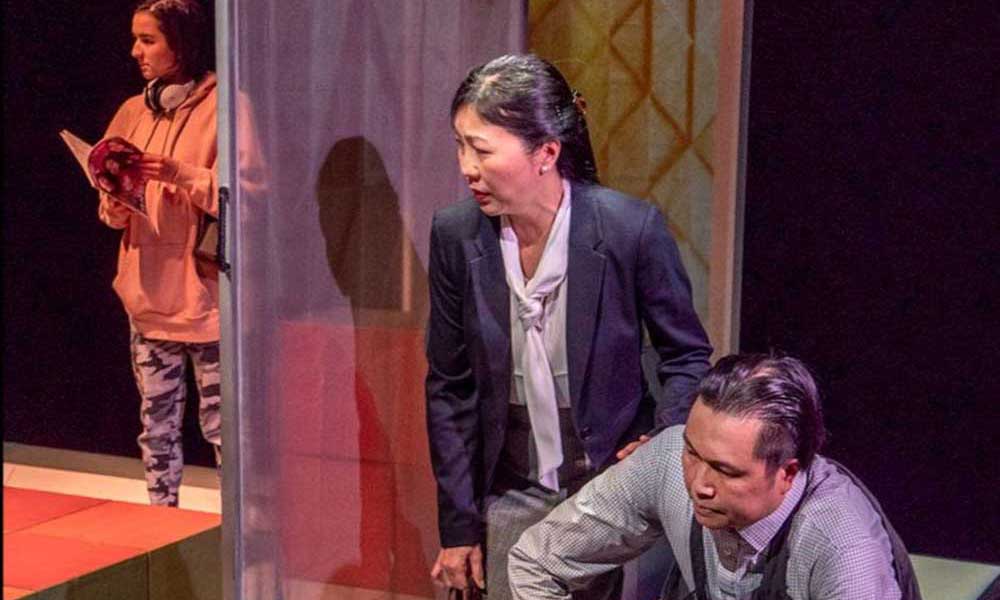 Kuroko_Kanon Hewitt_Manami Hara_John Ng_photobyChrisRandle Three actors on Stage performing a play