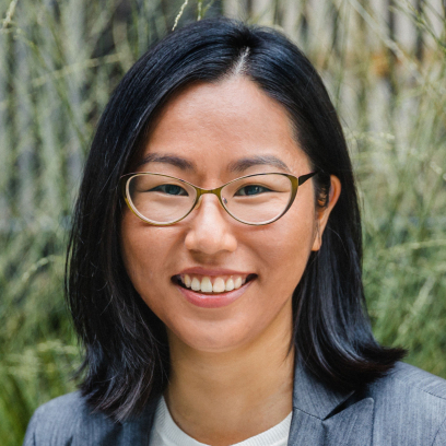 Headshot of Cheryl Tam, a smiling woman with dark hair and glasses