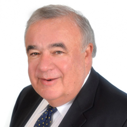 Headshot of Chief Justice Christopher Hinkson, a smiling man with short grey hair wearing a suit and tie