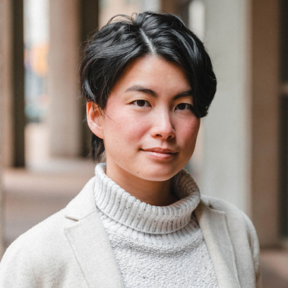 Headshot of Esther Tung, a smiling person with short dark hair