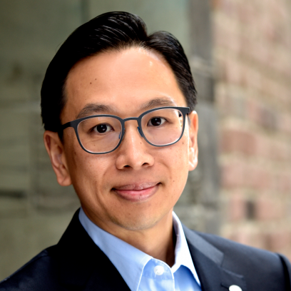 Eugene Lee Headshot of Eugene Lee, a smiling man with short dark hair wearing square framed glasses and a dark suit with light blue shirt
