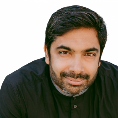 Headshot of Sirish Rao. He has dark salt-and pepper hair and beard and brown eyes, and is wearing a dark shirt.