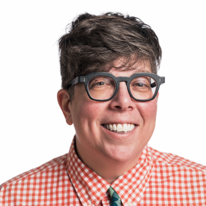 Headshot of Susan Grossman, a smiling woman with short curly brown hair wearing glasses