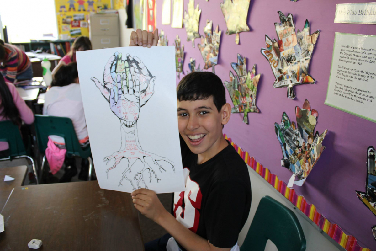 Child displaying a poster