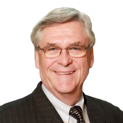 A smiling man with white hair and blue eyes wearing glasses and a suit and tie