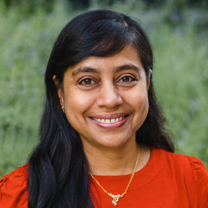 Headshot of Shanitha Rifayee, a smiling woman with long dark hair and dark eyes