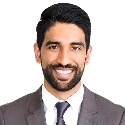 Sunny Johal Headshot of Sunny Johal. He has dark coiffed hair and a bear, and is wearing a light grey suit and dark grey tie.