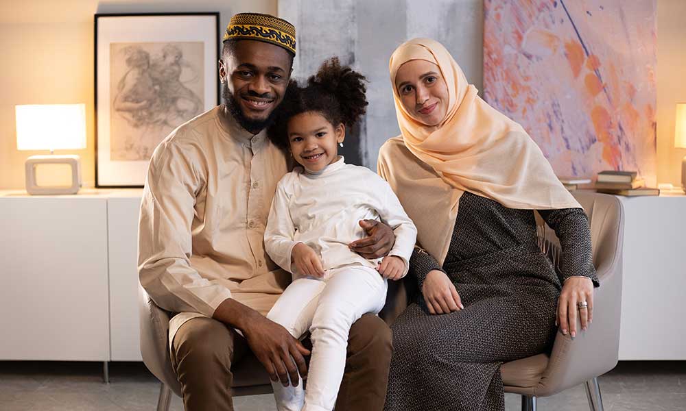 A family portrait of a Muslim couple and their child