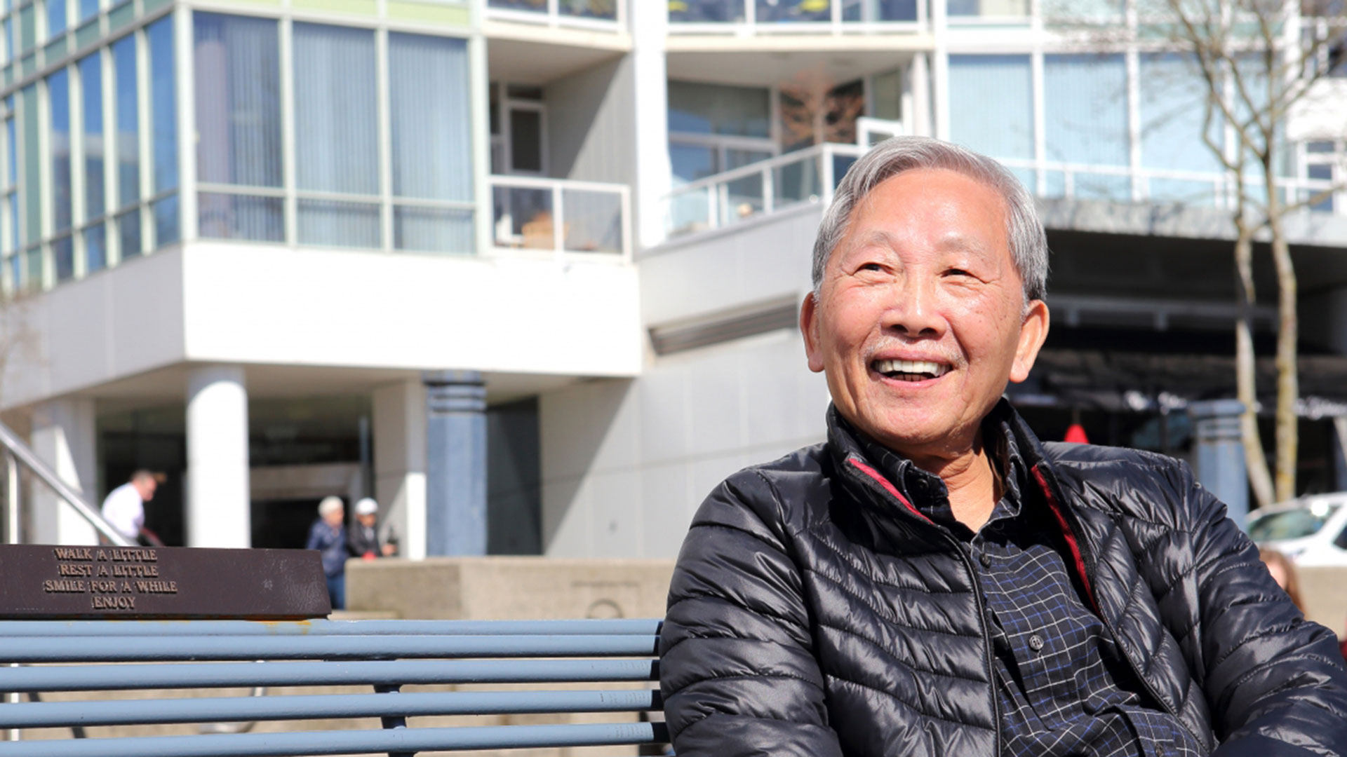 A picture of Monty Jang, an elderly man with grey hair, smiling