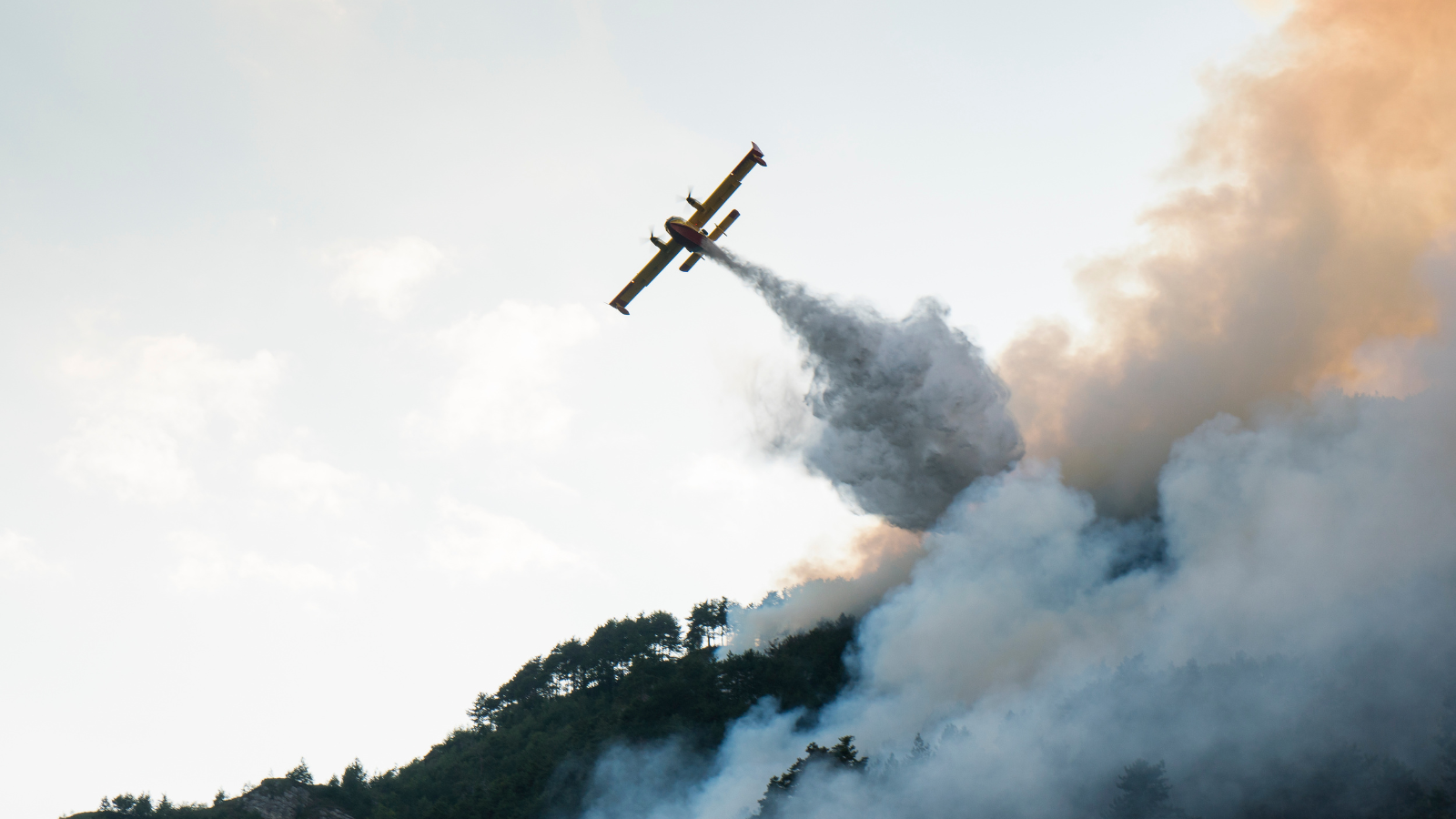 Firefighters in BC providing aerial coverage to combat spreading wildfires in BC's interior.