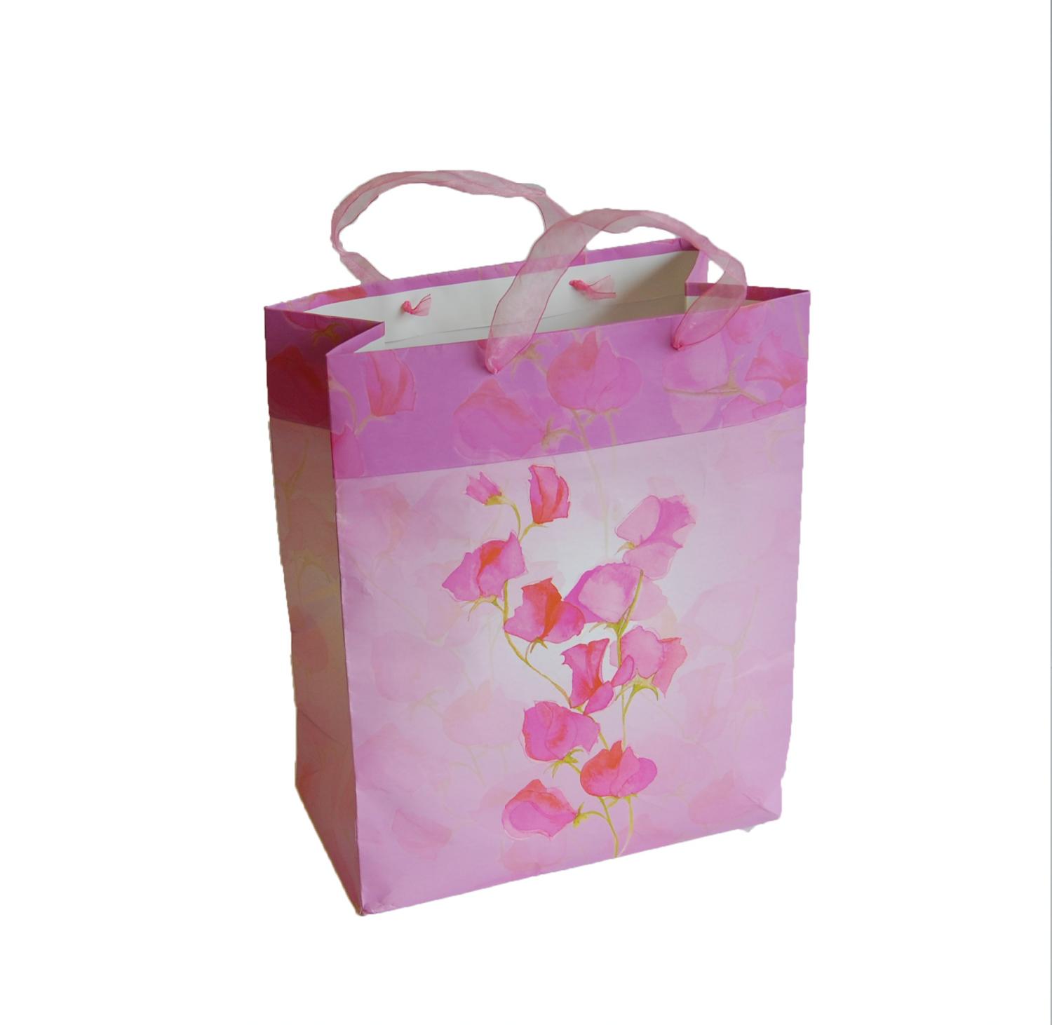 Pink rose patterned gift bag with pink organza ribbon handles